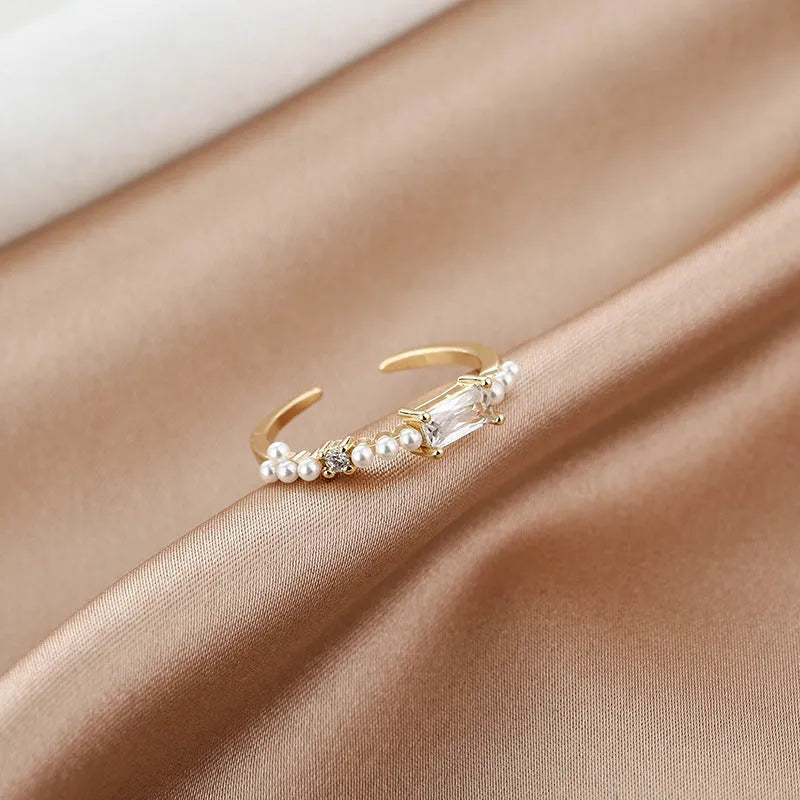 Women's gold-toned square alloy ring with diamond-cut surface and inlaid artificial gemstone on adjustable band