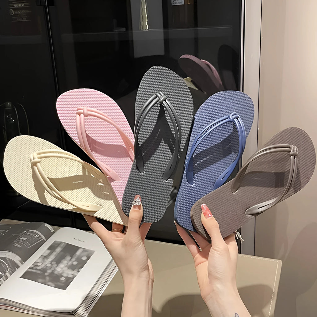 Men's PVC toe-covering flip flops in beige colour on a plain background.