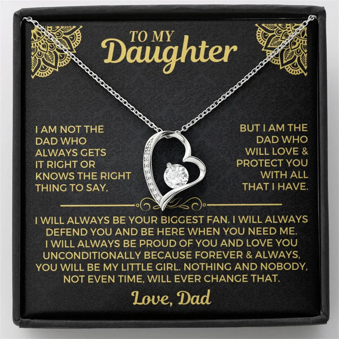 Silver and gold hollow heart necklace pendant presented on a card inside an open gift box.