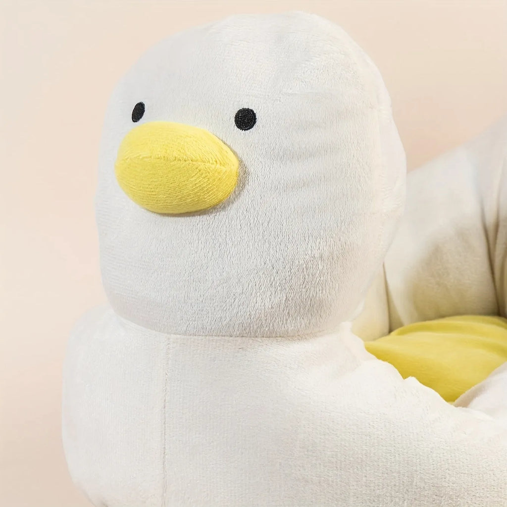 Blue duck-shaped fluffy pet bed sofa for small dogs and cats on a floor.