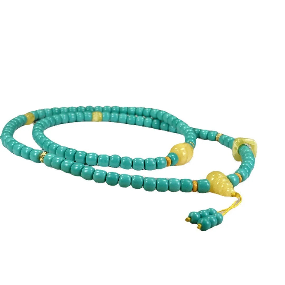 Turquoise stone pendant in hand-woven mesh flower setting on adjustable ball bead necklace chain