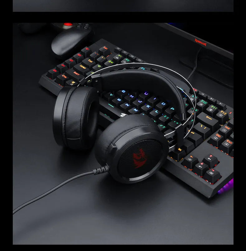 Black wired over-ear computer gaming headset with a long cable and a 3.5mm plug.