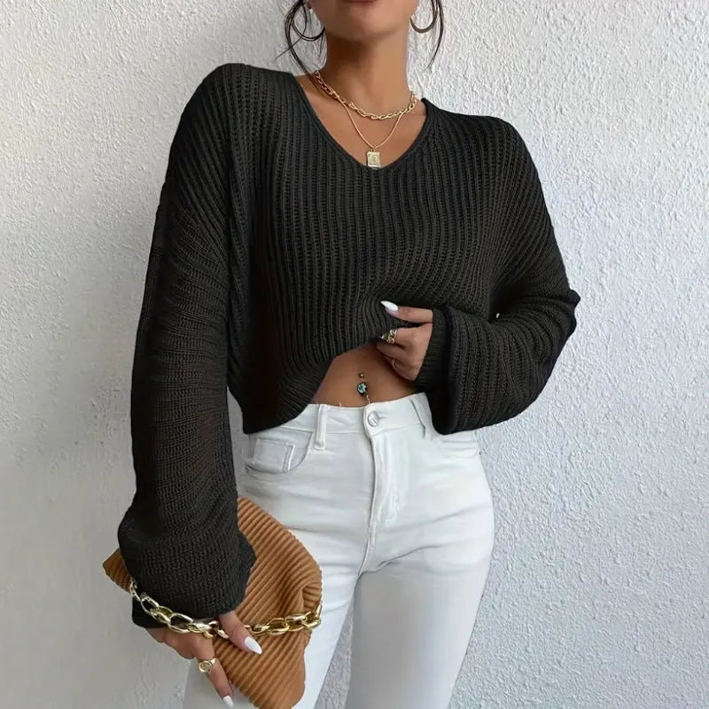 Women's solid colour long sleeve pullover in loose casual fit, shown in available colour options.