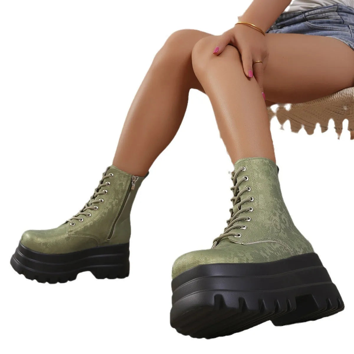 Women's white retro platform Martin boots with chunky heel and side zipper on a neutral background.