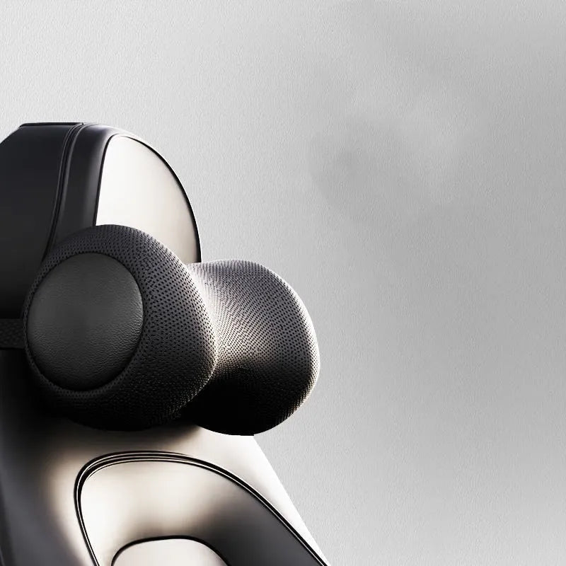 A black car massage cushion with electric vibration controls, placed on a car seat for neck and lumbar support.