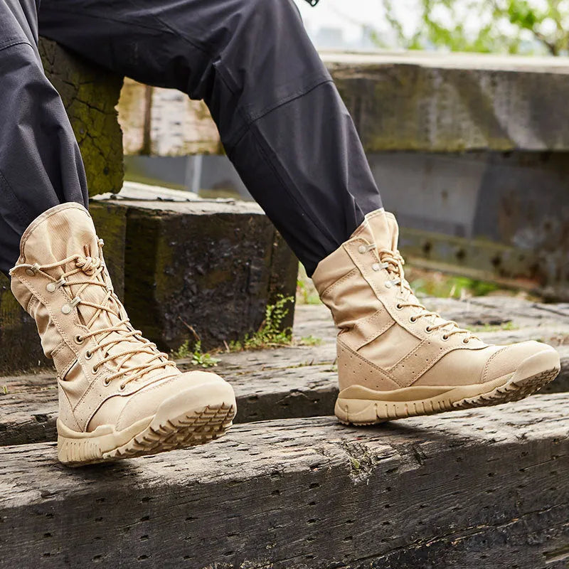 Yulong combat tactical desert boots in black and sand colour on a rocky outdoor background.