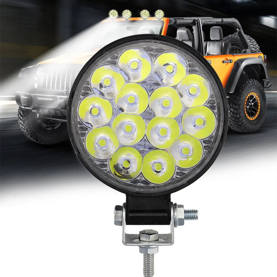White aluminium LED work light unit with IP67 waterproof rating, suitable for car and off-road vehicle mounting.