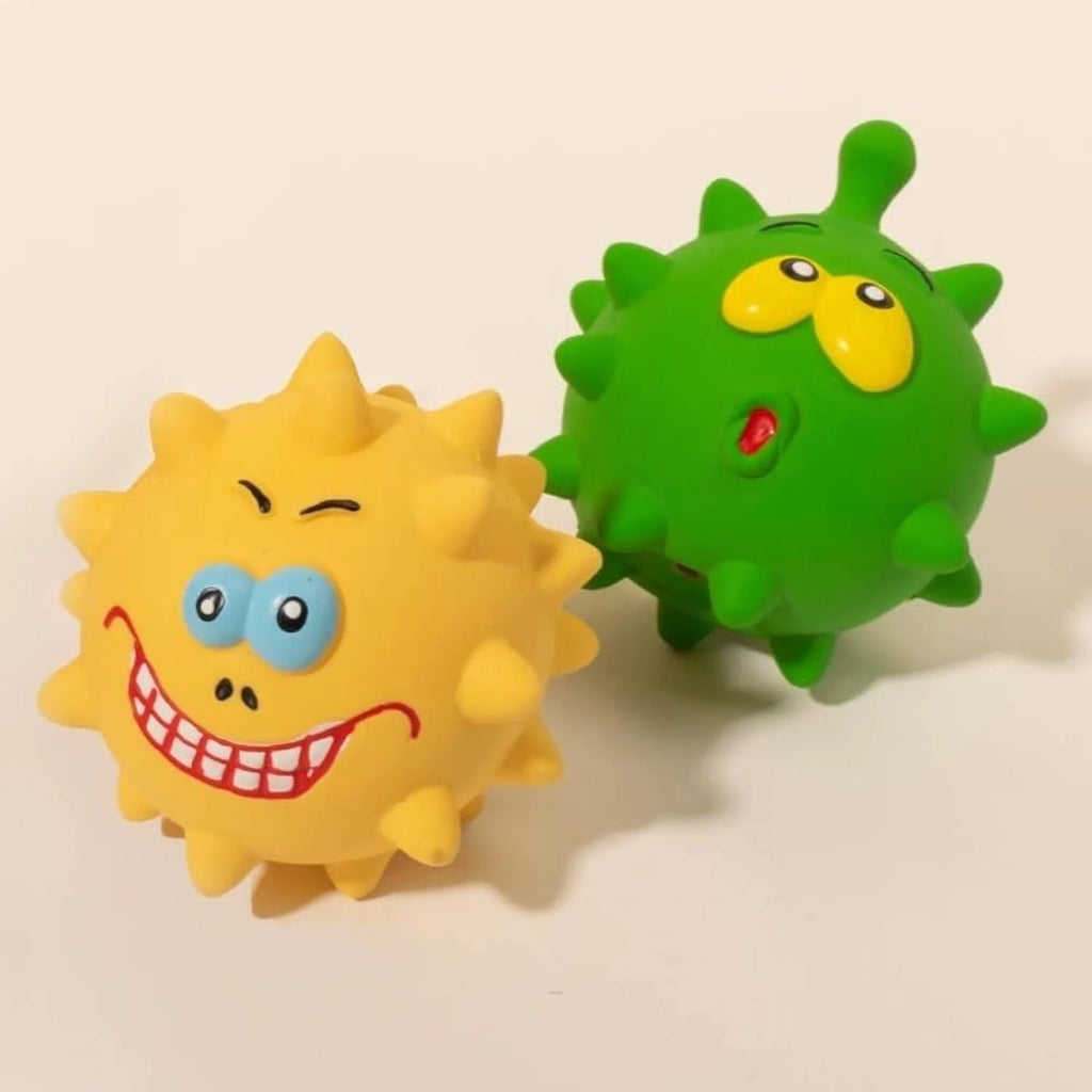 Four colourful squeaky dog balls with textured surfaces and cute faces