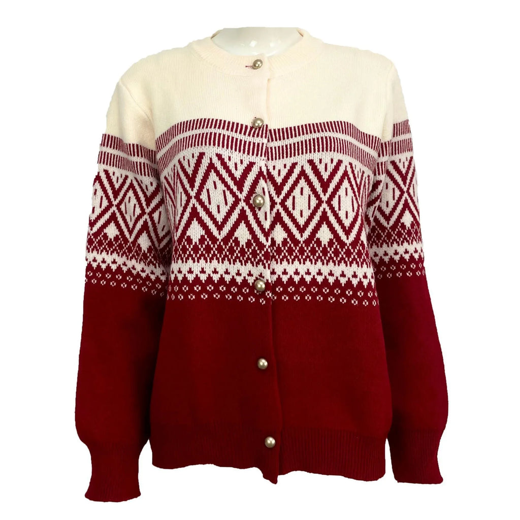 Woman wearing a red alpaca wool cardigan with a diamond knit pattern and long sleeves.