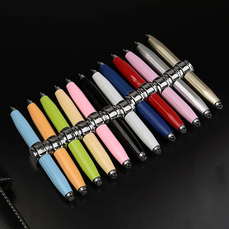 Metal gyro ballpoint pen with a spinning top, shown with multiple ink colour options.