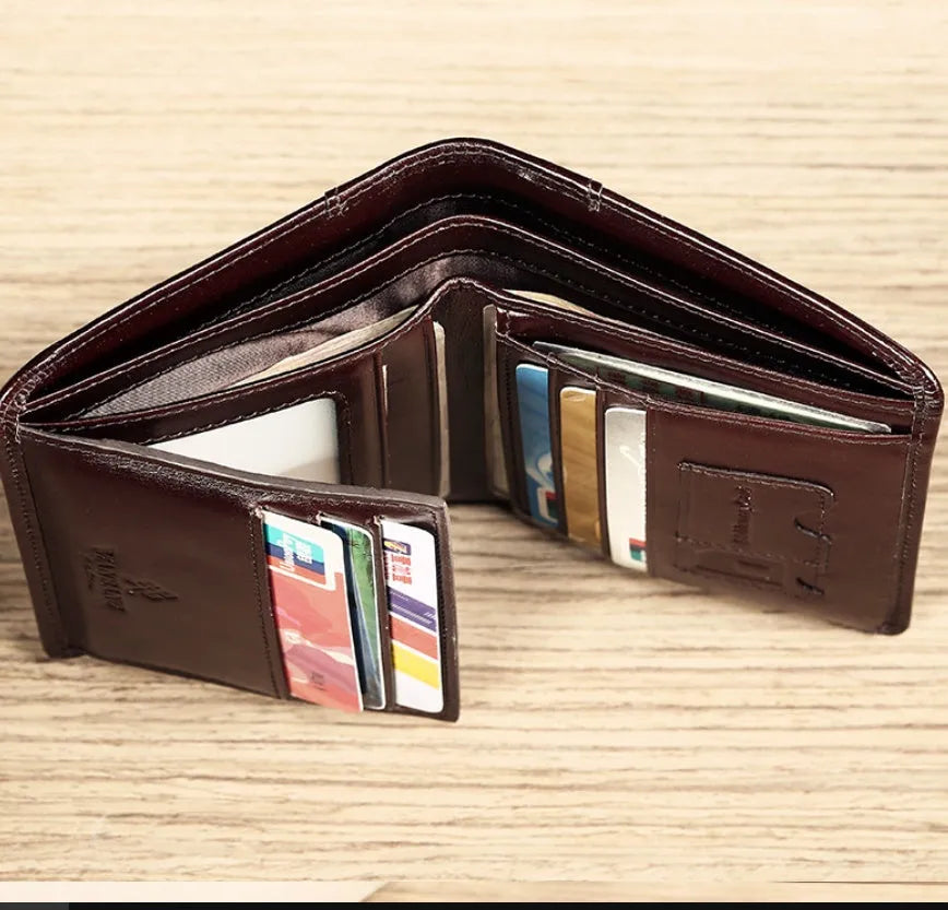 Men's leather wallet open showing photo slot, card holders, banknote section and change compartment