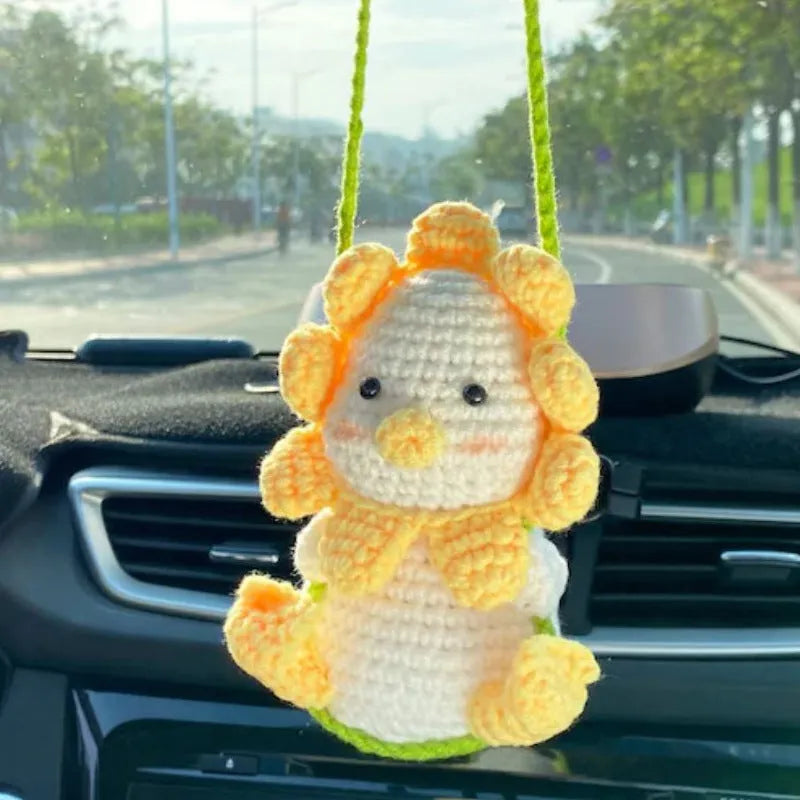 Green and white fish-scale style knitted wool car hanging planter with 8cm base and long white cord.