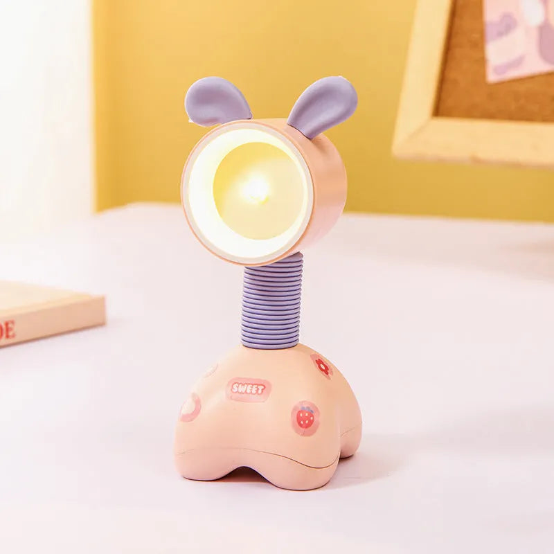 DIY magnetic cartoon small night lamp with multi-angle adjustable lighting on desktop