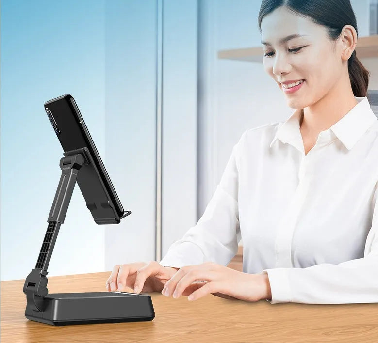 Black mobile phone broadcaster stand with wireless Bluetooth speaker and integrated HD microphone on desk