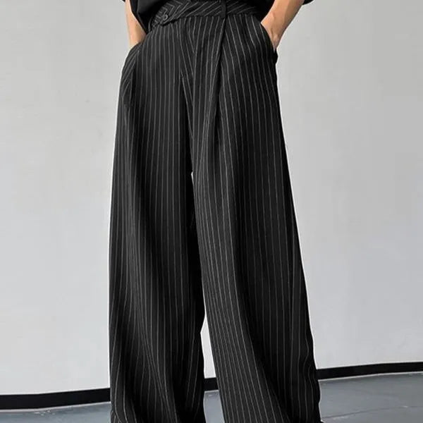 Men's black vertical striped pleated casual trousers laid flat.