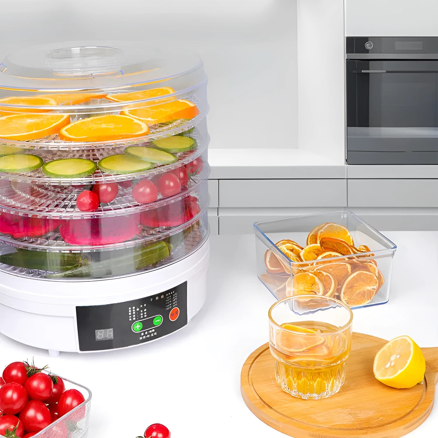 White five-layer food dehydrator with stackable mesh trays on a kitchen countertop.
