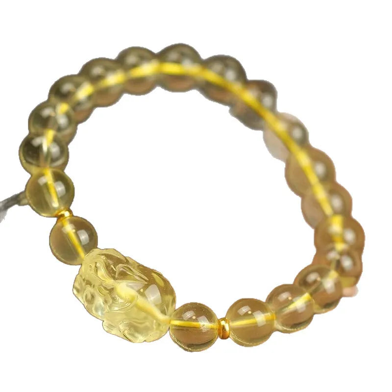 Yellow leather bracelet with a clear artificial crystal Pi Xiu charm.