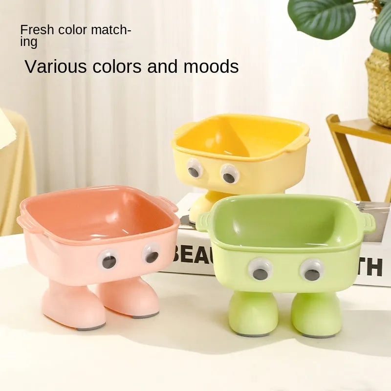 Green elevated cat bowl with robot design, tilted dish, and anti-slip base.