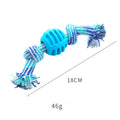 Blue silicone molar-ball dog chew toy with white rope ends on a wooden floor.