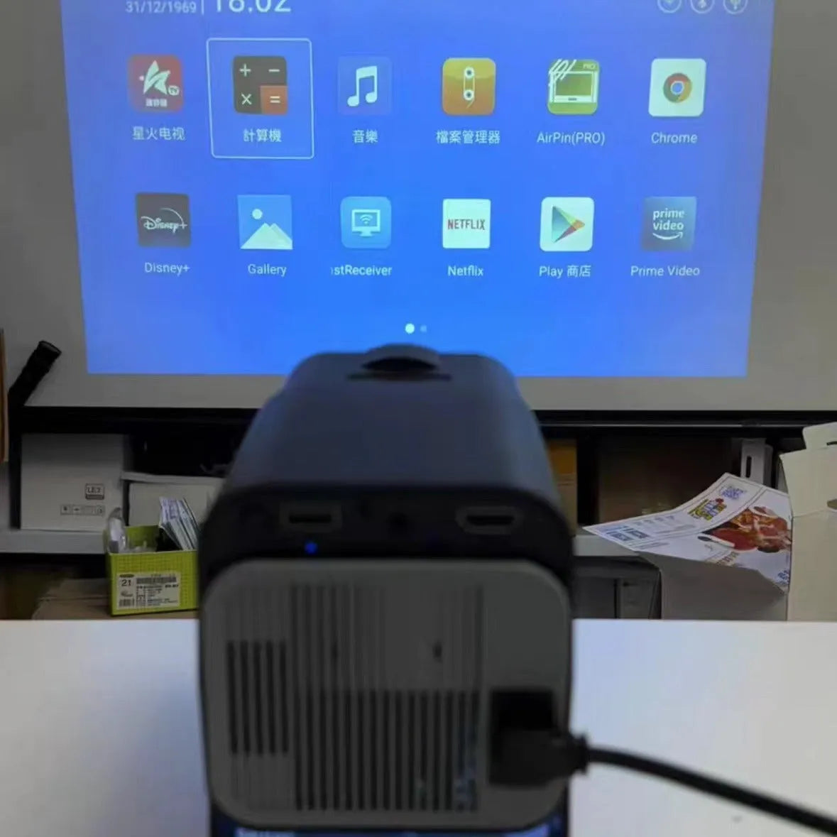 720p wireless home projector with carrying handle on white background