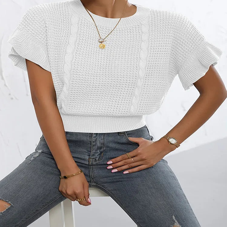 Knitted loose pullover sweater with ruffled short sleeves and a 3D twisted string pattern, shown in a neutral colour.
