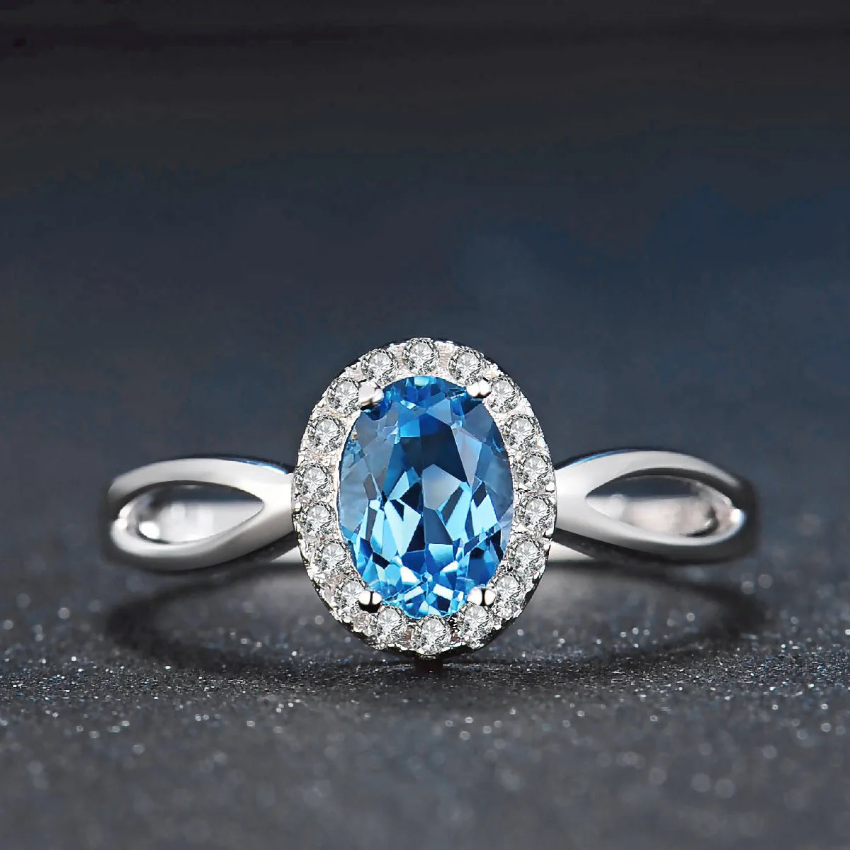 925 sterling silver jewellery set with Blue Topaz stones in geometric design including earrings, ring, pendant and necklace