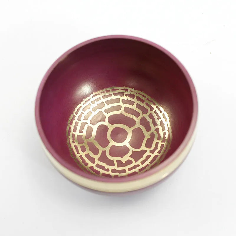 Seven colourful handmade Himalayan-style bowl percussion instruments arranged by size and colour