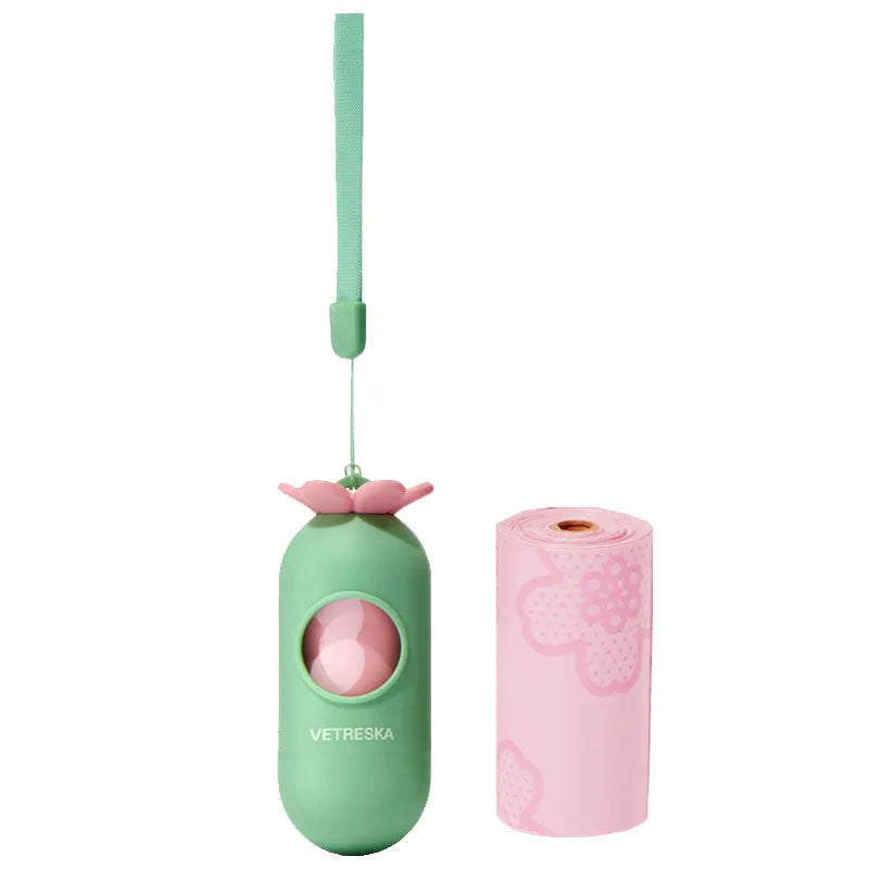Portable dog poo bag dispenser capsule with scented inner roll in strawberry, orange or cherry blossom options