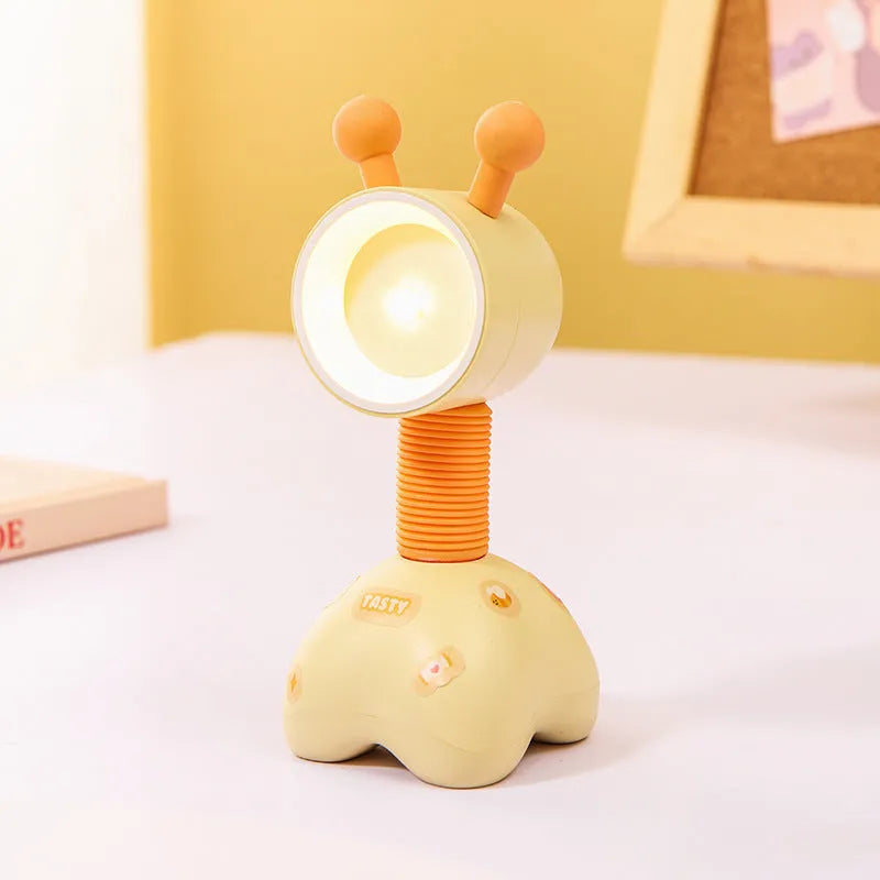 DIY magnetic cartoon small night lamp with multi-angle adjustable lighting on desktop