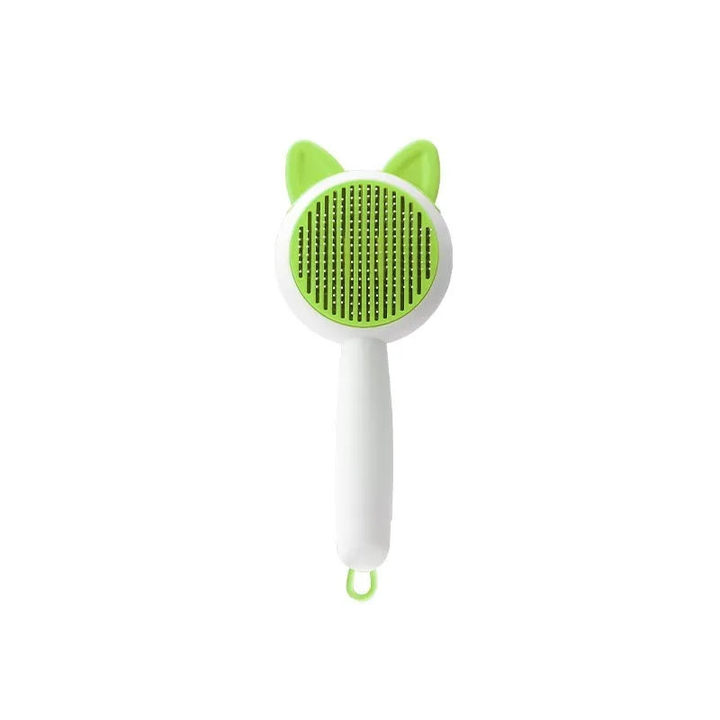 Self-cleaning cat grooming comb in greenish white and orange white colour options