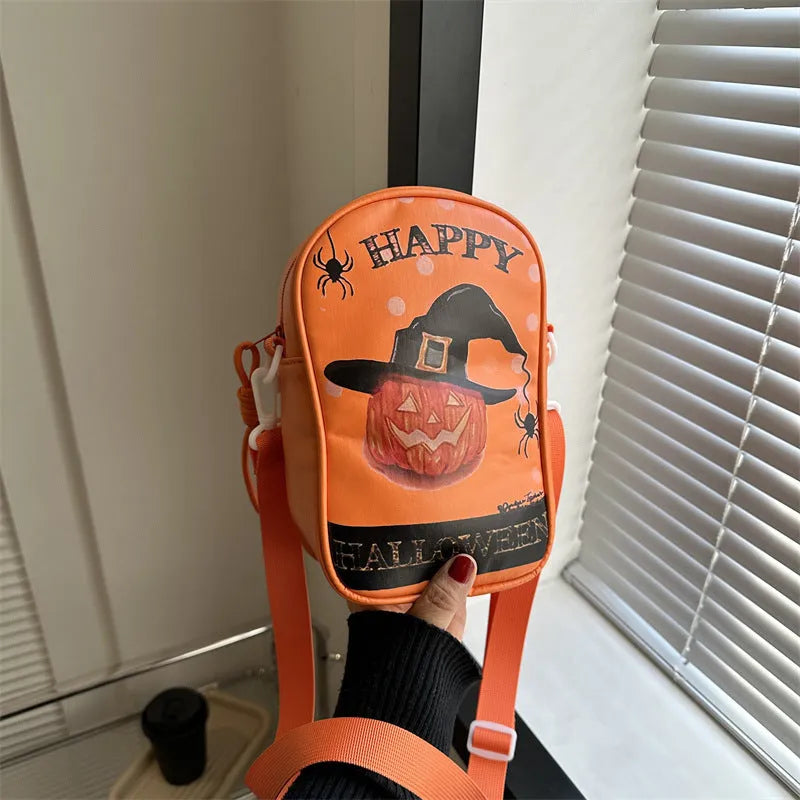Black mini crossbody bag with Halloween cartoon print of pumpkins, ghosts, and bats.