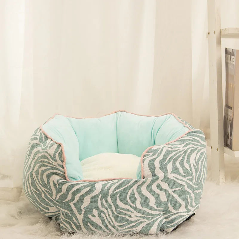 Blue octagonal pet bed with raised sides and a removable mat, for a small dog or cat.