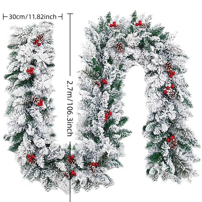 Artificial rattan Christmas garland with flocking snow effect draped on mantelpiece
