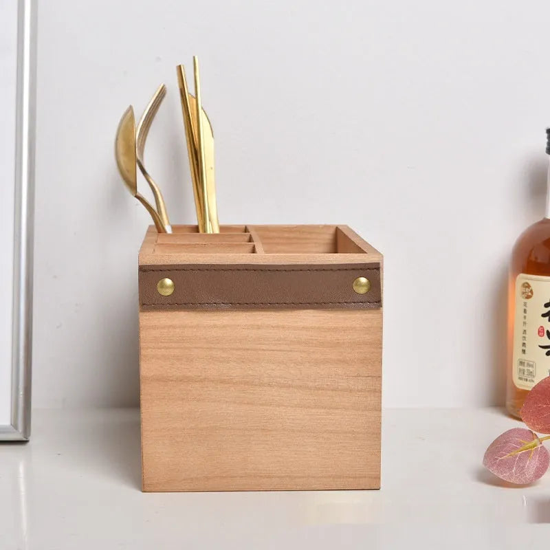 Wooden kitchen storage box for knives, forks, and chopsticks with internal dividers.