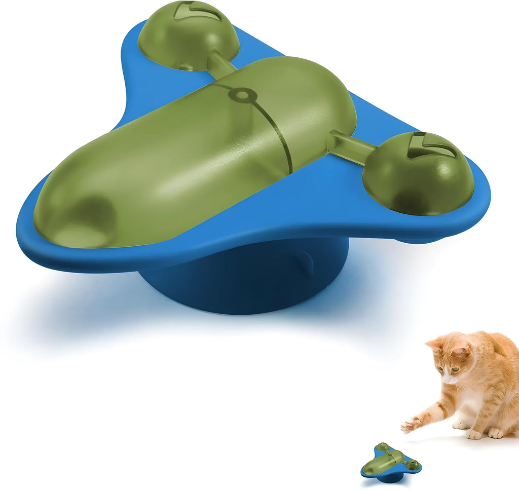 Blue interactive pet puzzle toy with snack cabin, bell, and catnip on a smooth floor.