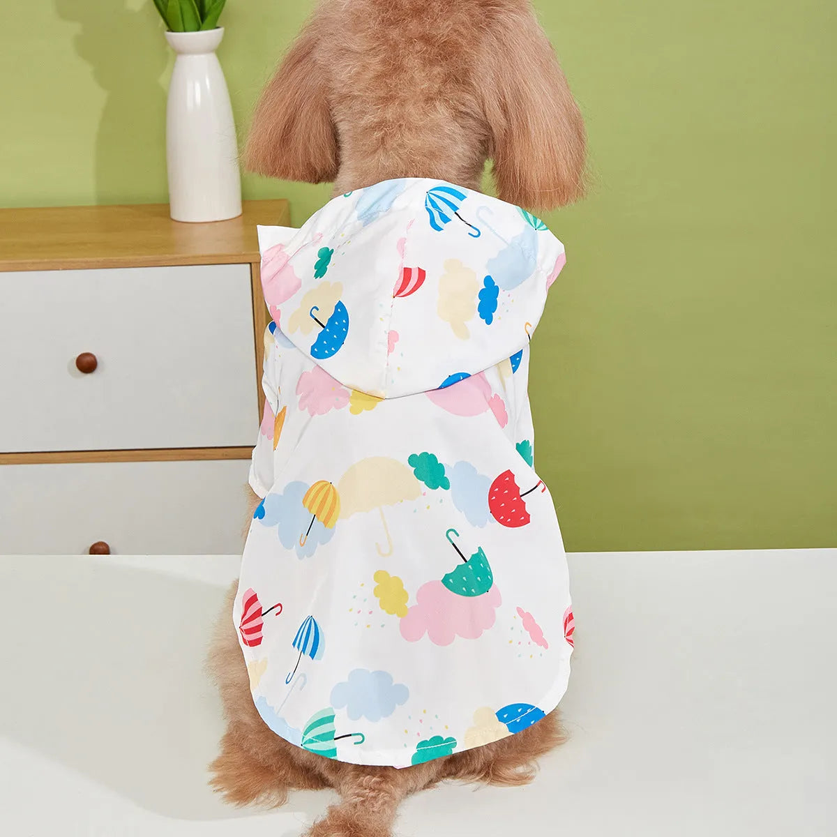 Colourful cartoon umbrella pattern pet raincoat for dogs in sizes XS to XL.