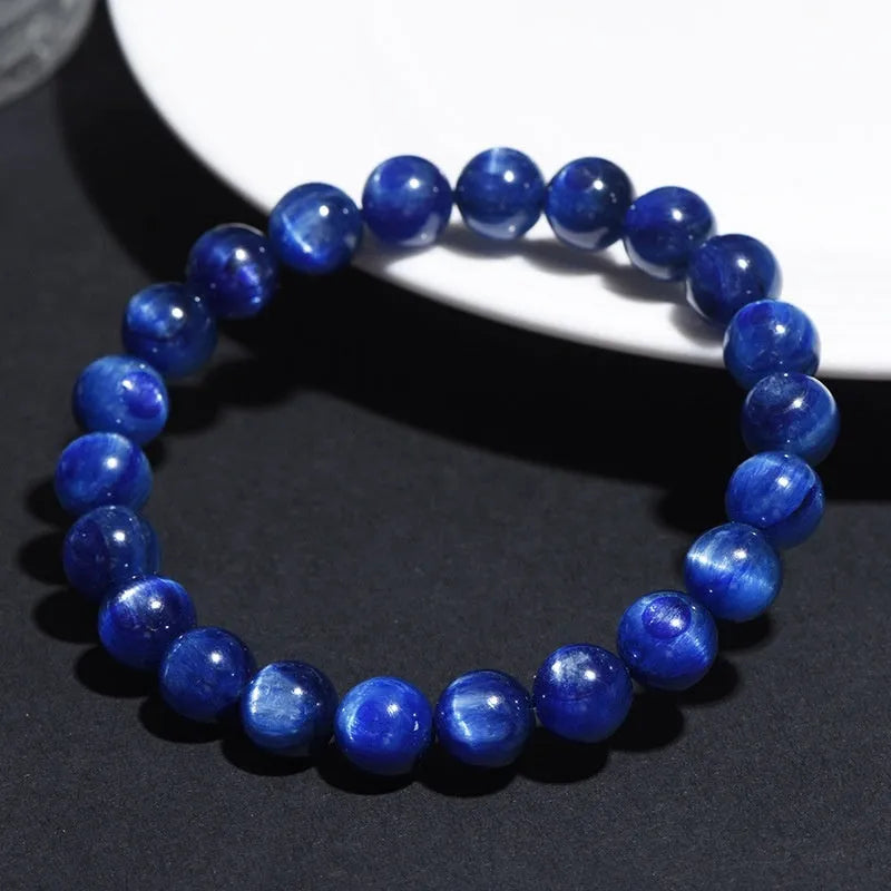 Polished grade 7A blue crystal bracelet with geometric ruyi design, shown in single circle and piece sizes.