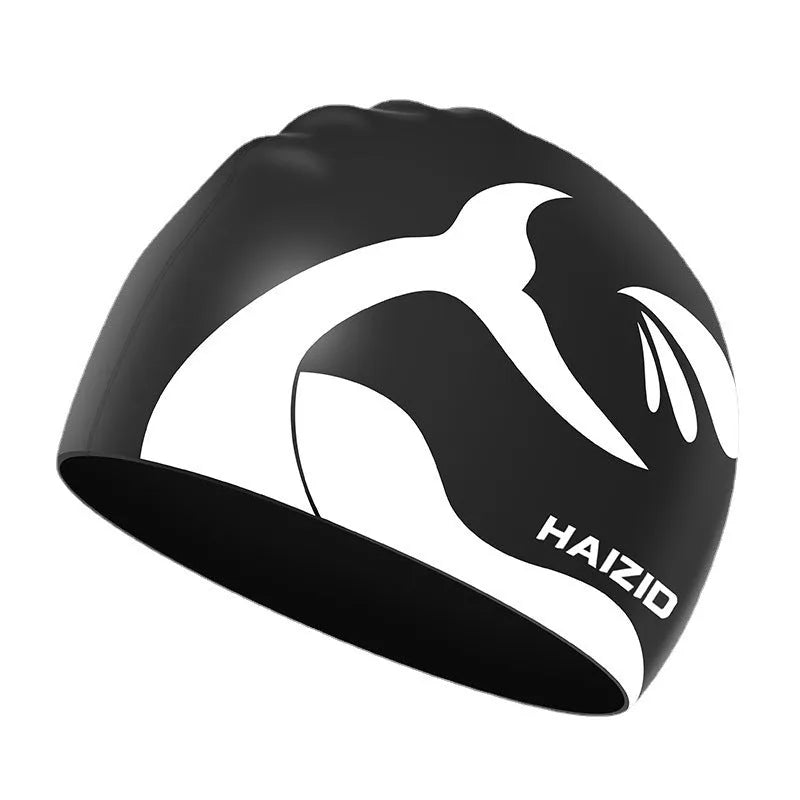 Silicone swimming cap with whale tail pattern and moulded ear protectors in various colours.