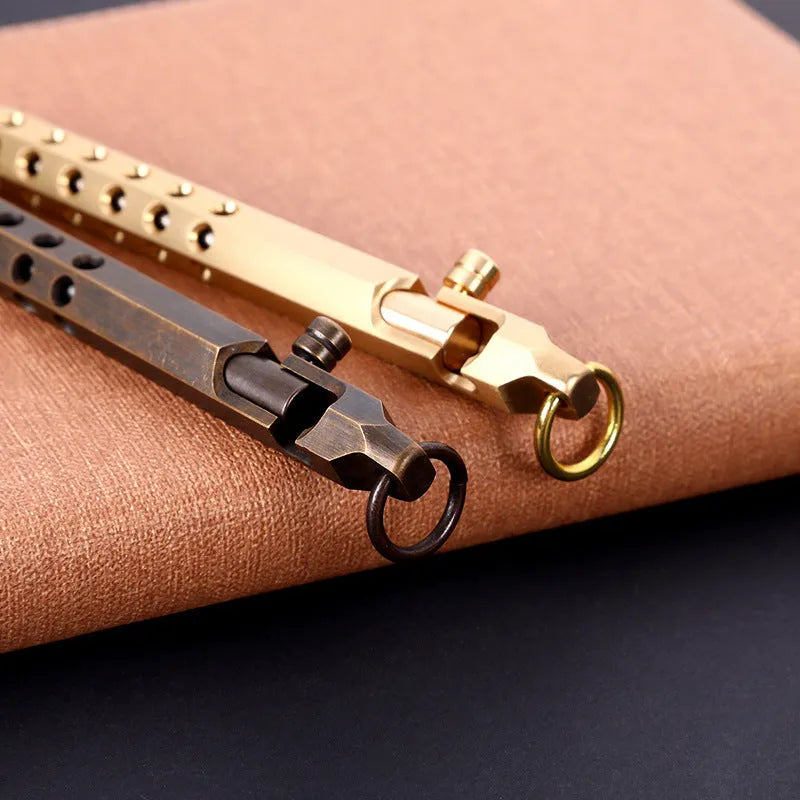 Brass hexagonal bolt pen with 0.5mm tip showing hexagonal profile and signature roller mechanism