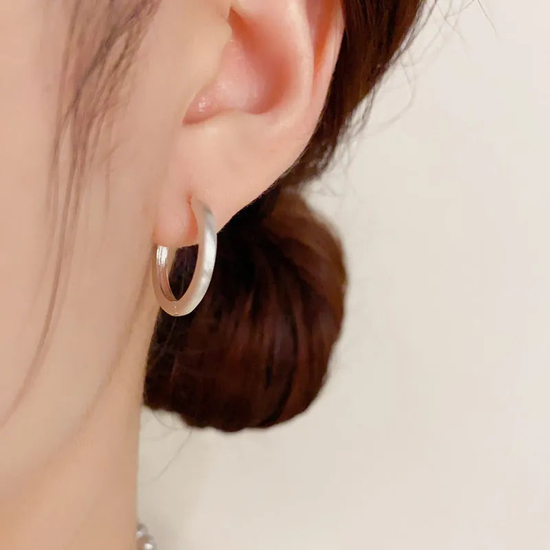 Geometric round women's ear clip with real gold plating in gold and silver colour options