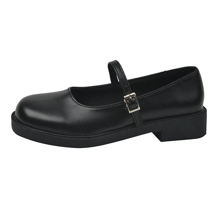 Women's solid colour French vintage flat shoes with round toe and PU leather upper.