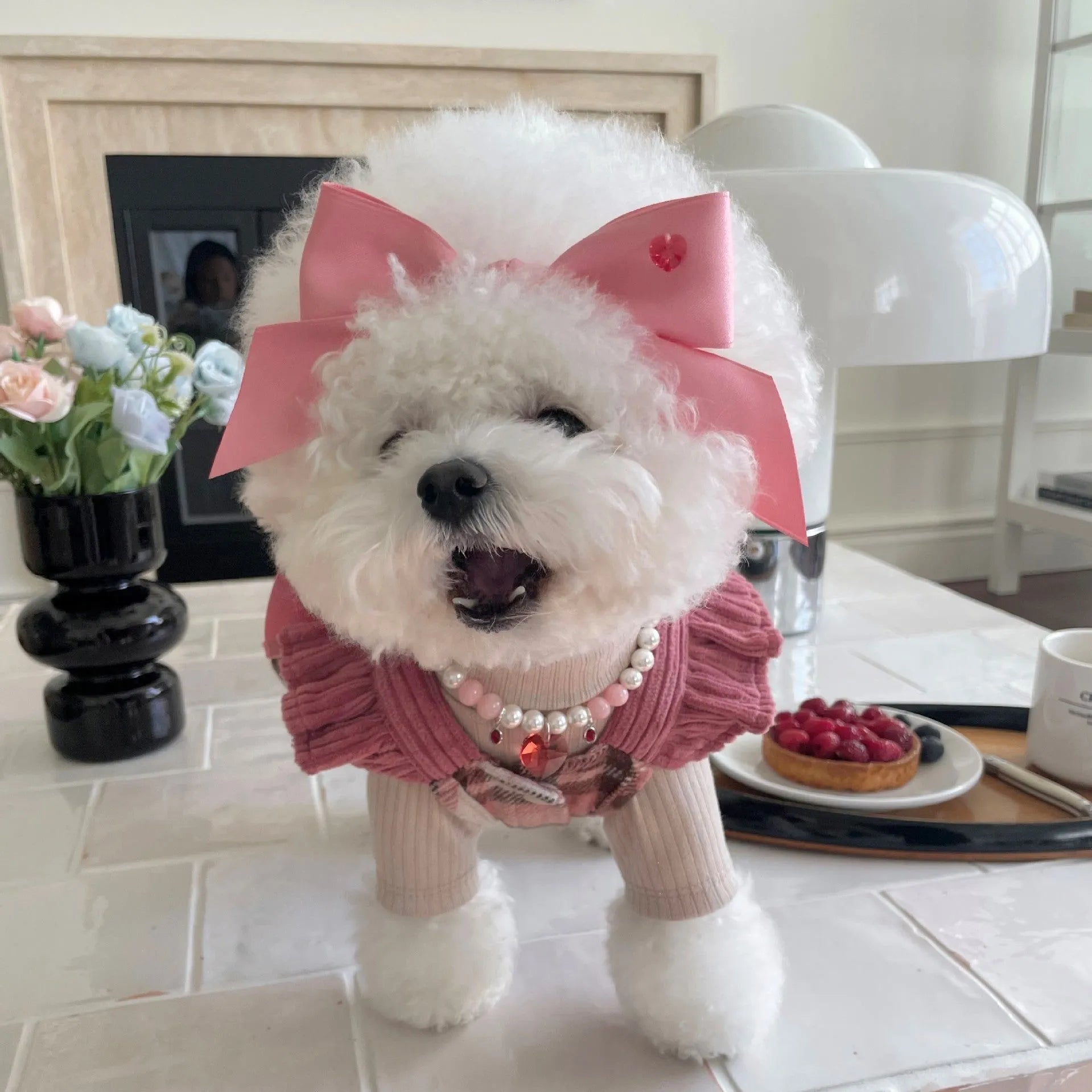 Adjustable pink princess bow hair band on a dog, made from double-sided polyester cotton ribbon.