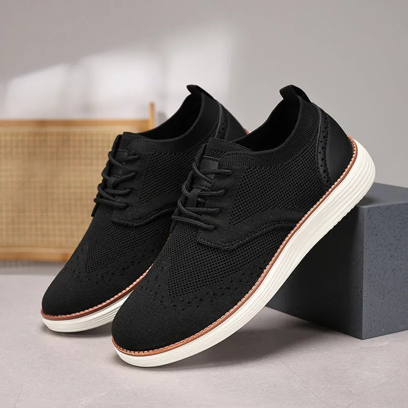 Men's breathable mesh hiking shoes in black with rubber sole and low heel, side view