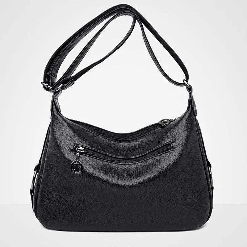 Large blue soft PU women's shoulder bag with a zipper and organised interior compartments.
