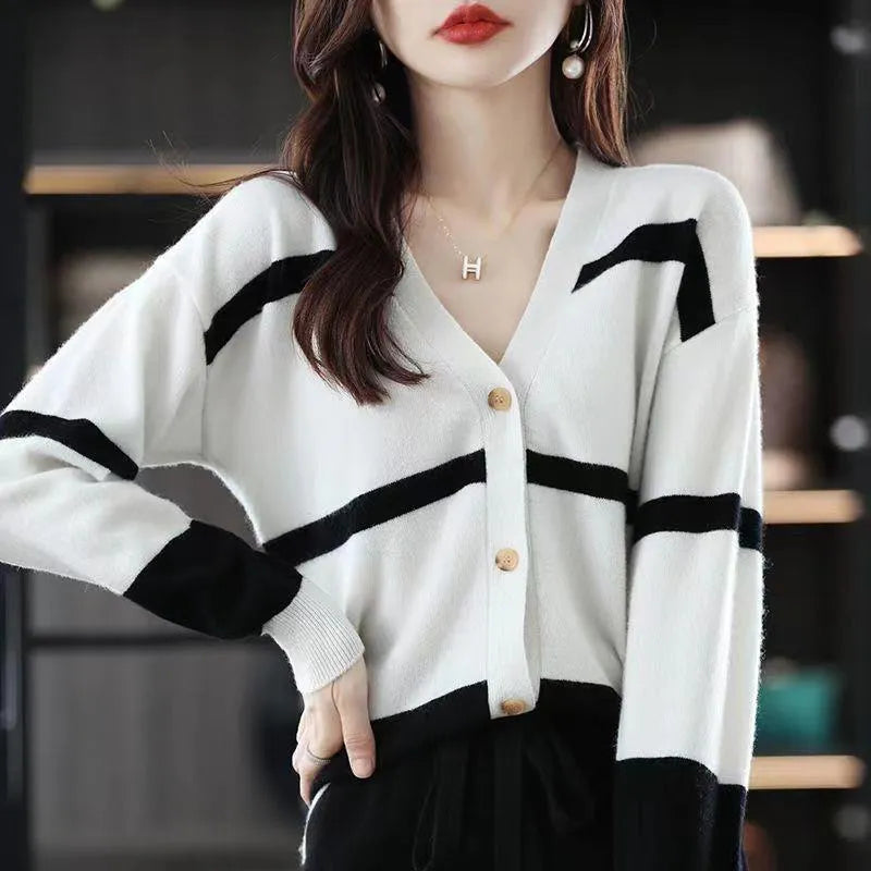 Women's striped V-neck knitted cardigan with 3D pattern in camel colour.