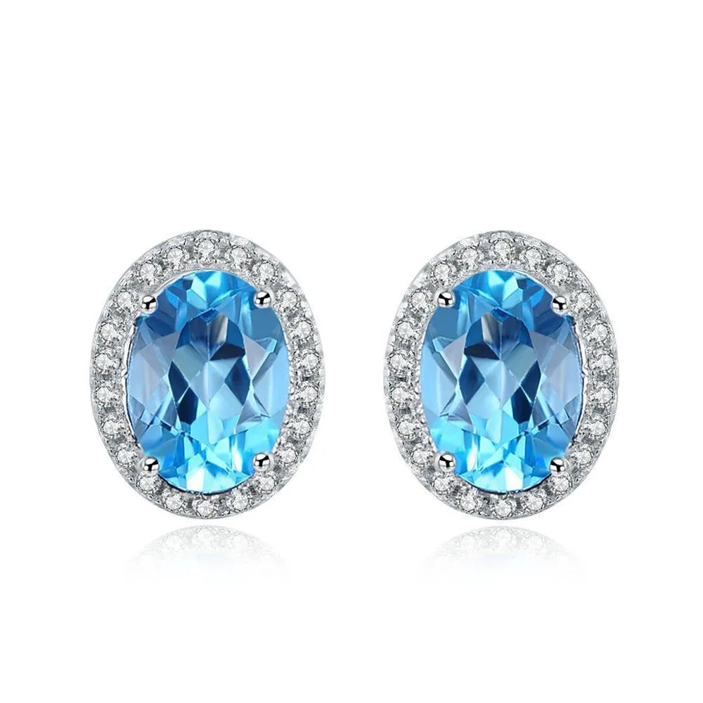 925 sterling silver jewellery set with Blue Topaz stones in geometric design including earrings, ring, pendant and necklace