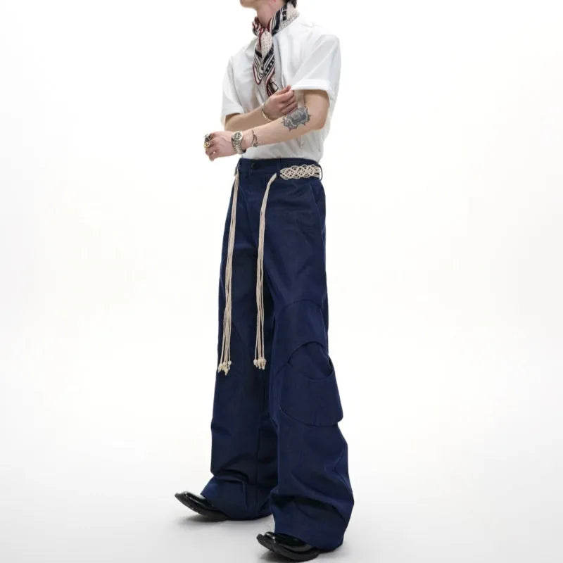 Men's dark blue straight-leg jeans with 3D cutting, belt stitching, and decorative pocket details