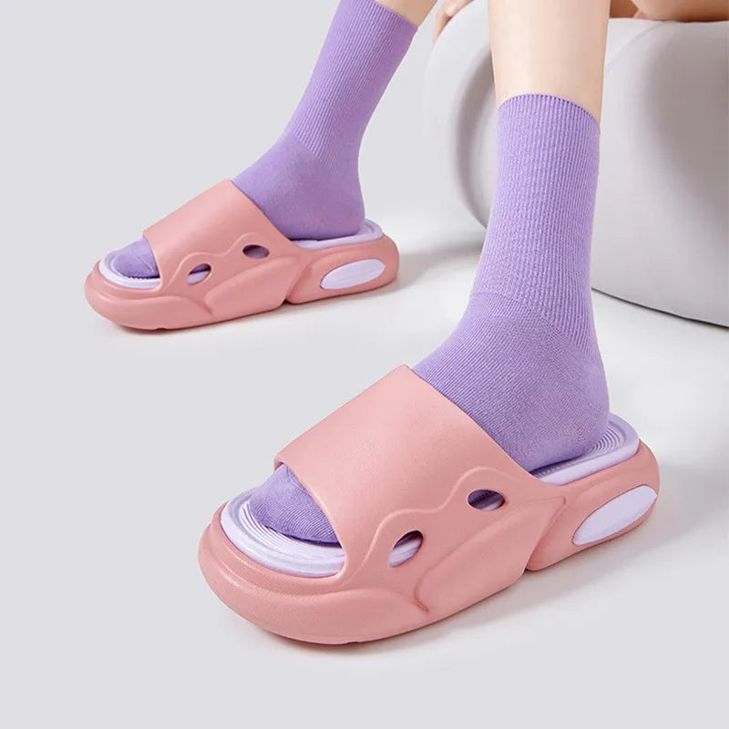 Two-colour EVA foam couple slippers with thick soles and leather lining in black white combination