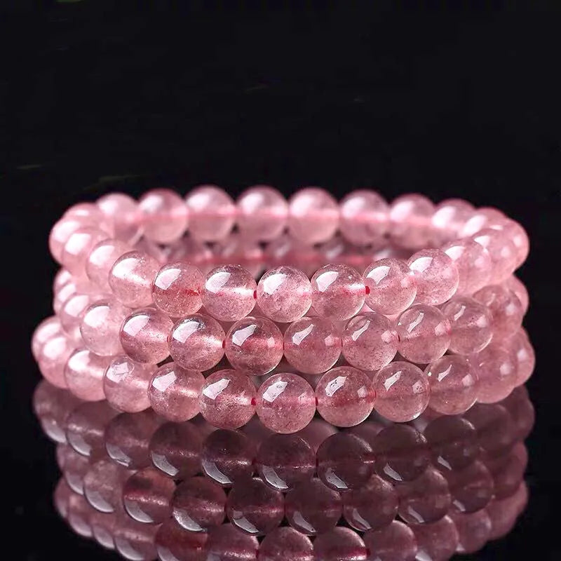 Women's strawberry quartz bracelet with polished crystal beads in choice of 6mm, 8mm or 10mm sizes