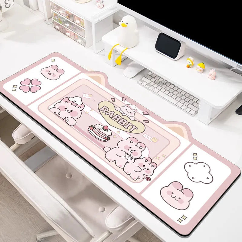 Natural rubber oversized desk pad showing pink bunny, purple bear, and purple kitten colour options